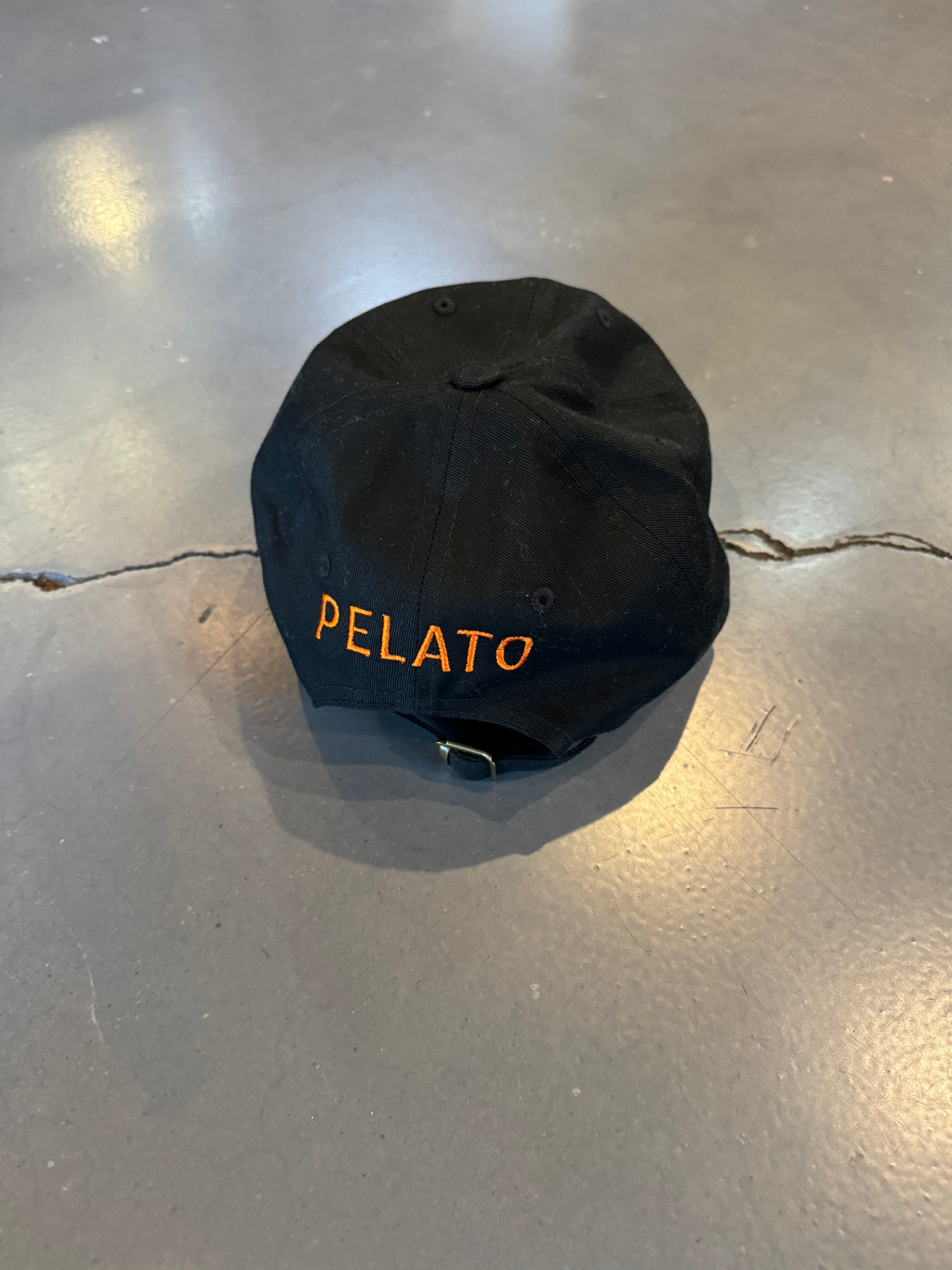 Pelato accessories flat lay with brand tag